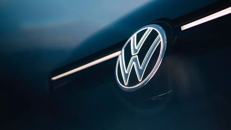 Volkswagen Golf GTI front view with illuminated logo and red GTI accents