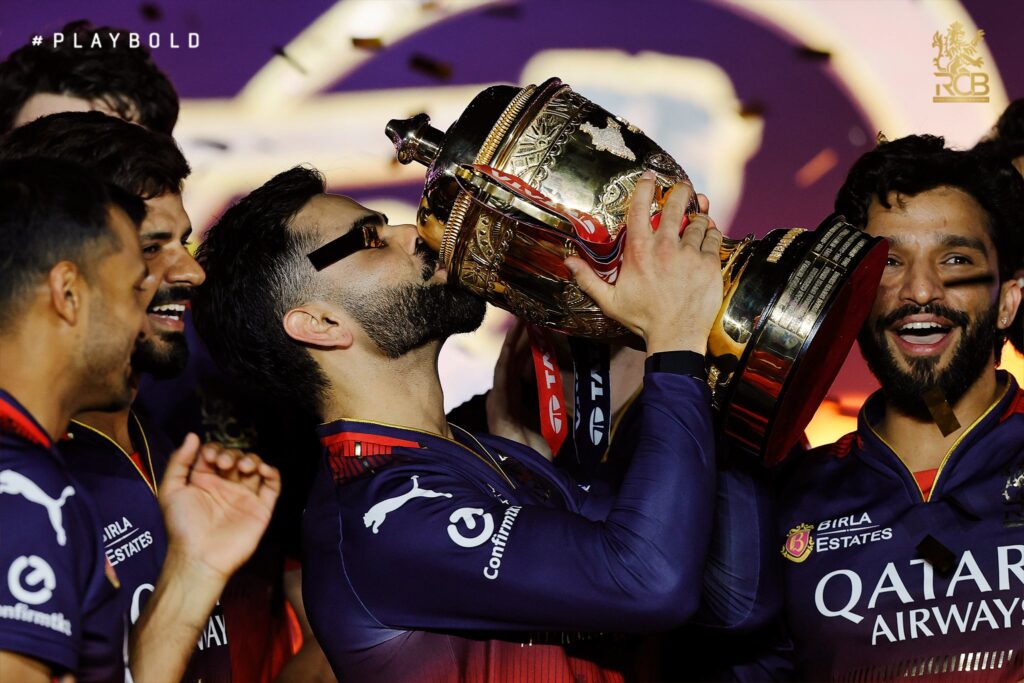 Virat Kohli celebrates RCB IPL 2025 win lifting the trophy in Ahmedabad