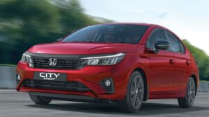 Front view of Honda City Sport Edition 2025 in Radiant Red Metallic with gloss-black grille and sporty accents