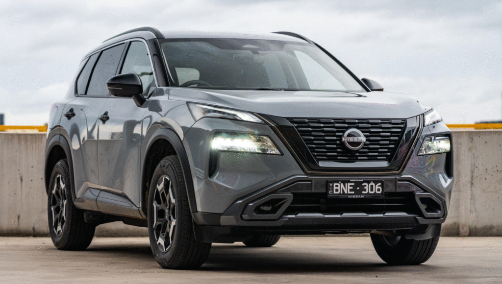 Side view of 2025 Nissan X-Trail SUV on a scenic Indian highway