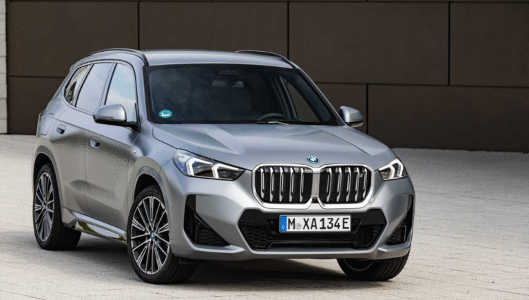BMW iX1 front view with LED headlamps and iconic grille - bmw ix1