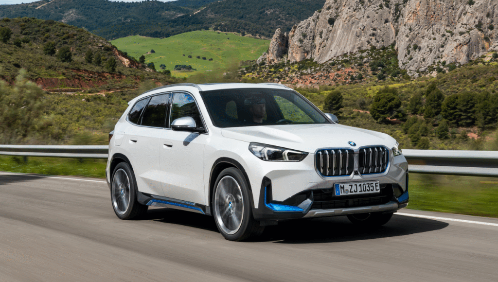 BMW iX1 front view with LED headlamps and iconic grille - bmw ix1