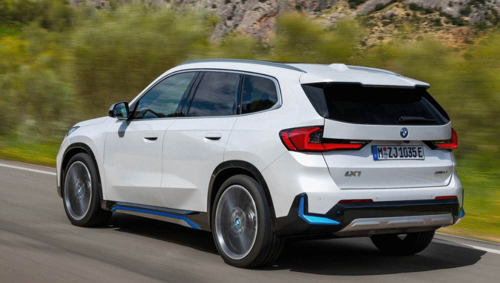 BMW iX1 rear profile showcasing sharp design and alloy wheels - bmw ix1 lwb