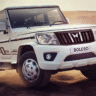 Mahindra Bolero 2025 driving through rural Indian roads